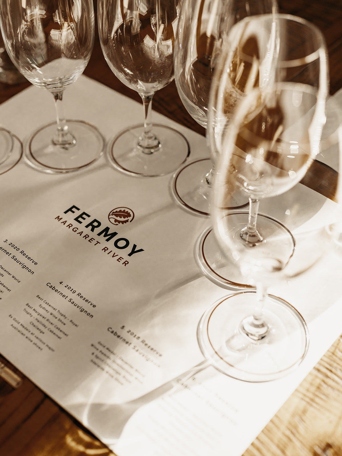 Fermoy winery cellar door wine tasting experience with glassware on the tasting mat.